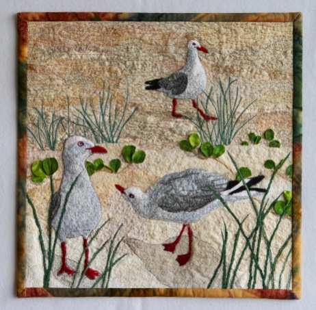 Silver Gulls 12" x 12" made for SAQA Benefit Auction 2018 Cotton Raw edge applique, couched velour yarn, machine stitching
